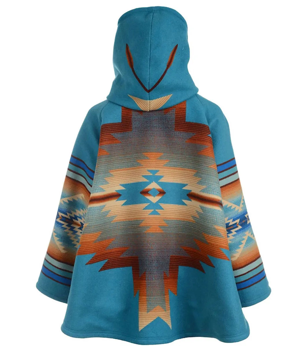 A hooded cape-style poncho with a vibrant turquoise blue base and a large Southwestern geometric pattern in orange, beige, and brown on the back, shown against a plain white background.
